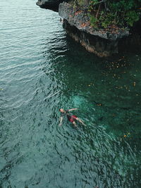 High angle view of man swimming in sea