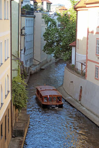 High angle view of canal amidst buildings in city