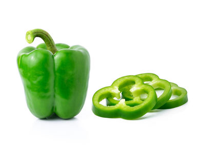 Close-up of green bell pepper against white background