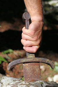 Cropped image of hand holding tool