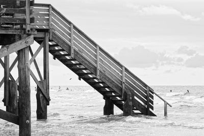 Pier over sea against sky