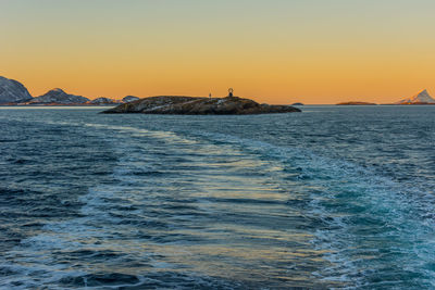 Scenic view of sea against clear sky during sunset