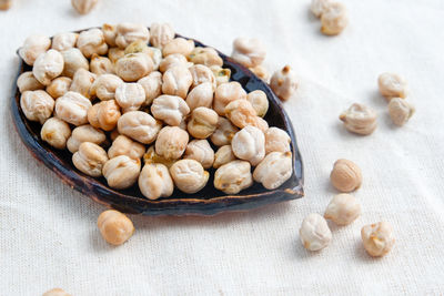 High angle view of almonds in bowl on table
