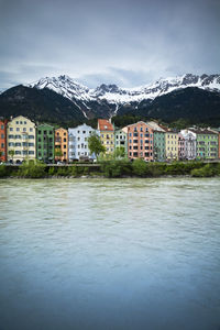 Buildings in city against sky during winter