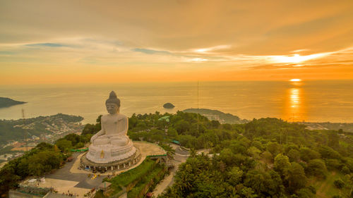 Scenic view of temple building against sky during sunset