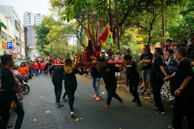 Group of people on street in city