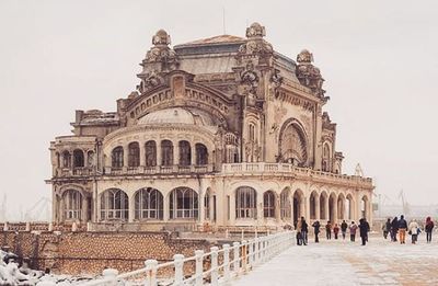 Tourists in front of historical building