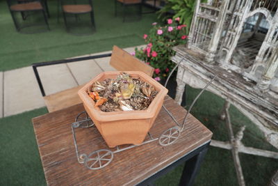 High angle view of potted plants on table at yard