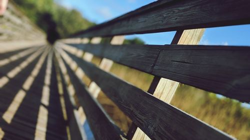 Close-up of wooden fence against sky