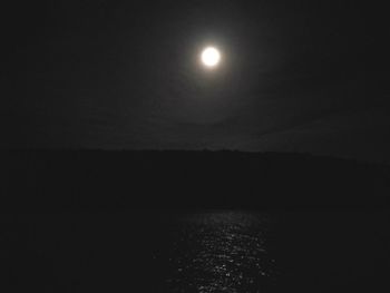 Scenic view of sea against clear sky at night