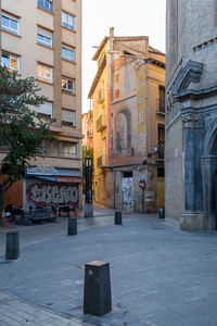 View of city street and buildings against sky