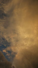 Low angle view of dramatic sky during sunset