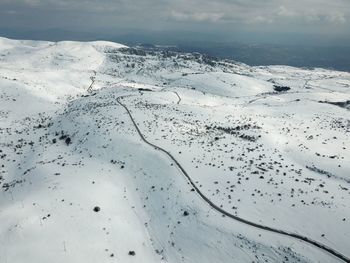 Scenic view of snowcapped mountain against sky