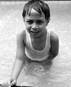 Portrait of smiling boy in swimming pool