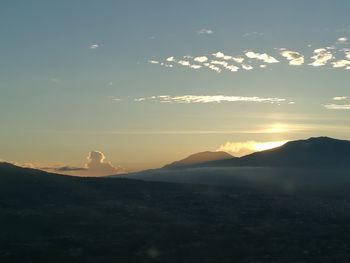 Scenic view of mountains against sky during sunset