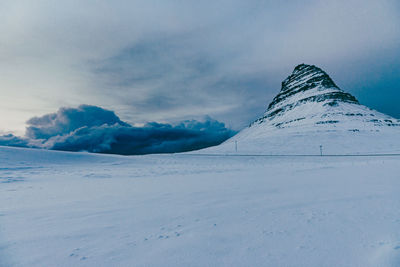 Scenic view of snowcapped mountain against sky