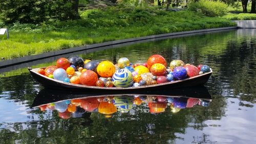 Multi colored floating on water in lake
