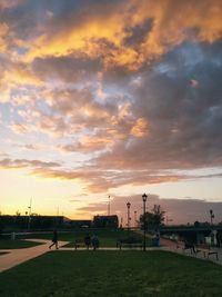 Scenic view of park against sky during sunset