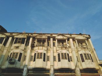 Low angle view of building against blue sky