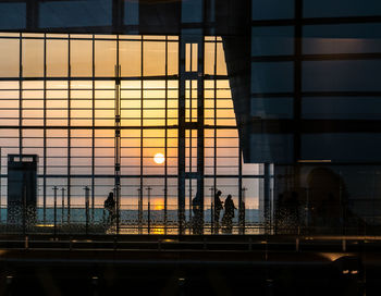 View of illuminated city at sunset