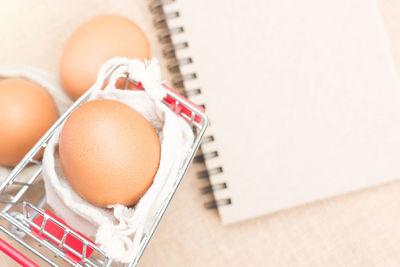 High angle view of eggs in container on table