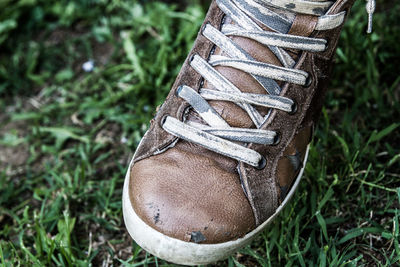 Low section of shoes on field