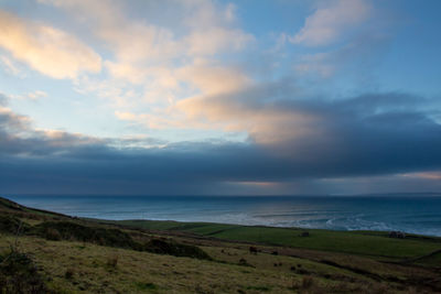 Scenic view of sea against sky during sunset