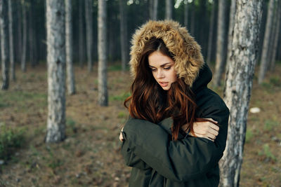 Beautiful young woman in forest