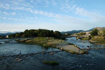 High angle view of river against cloudy sky