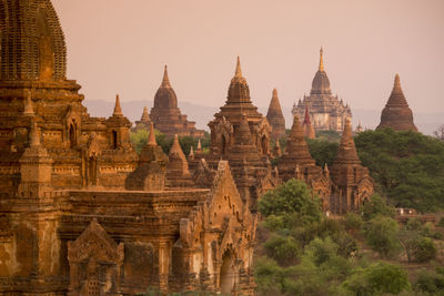 Historic temple against sky during sunset