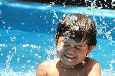 Portrait of shirtless boy in swimming pool