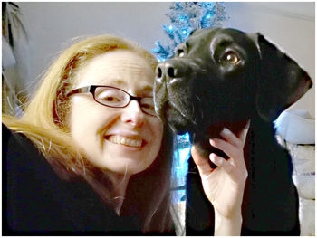 Portrait of smiling woman with dog