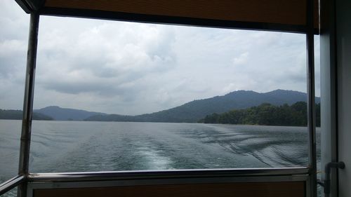 Scenic view of sea seen through window