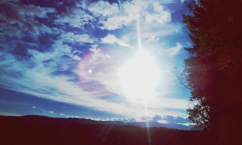 Scenic view of landscape against cloudy sky