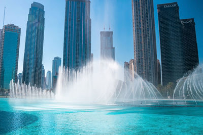 The dancing fountains near burj khalifa skyscraper in dubai.