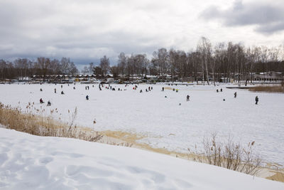 Scenic view of snow covered landscape against sky