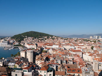 High angle shot of townscape against clear blue sky