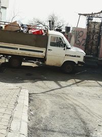 Car on street against sky