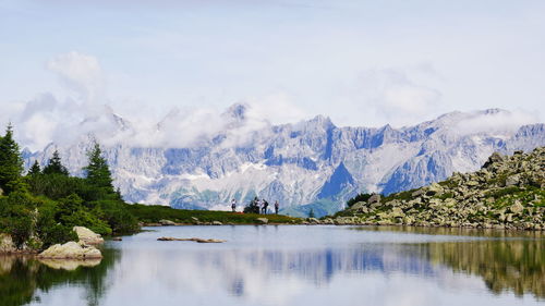 Scenic view of lake against cloudy sky