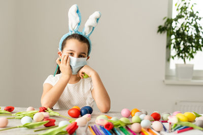 Portrait of girl holding colorful candies