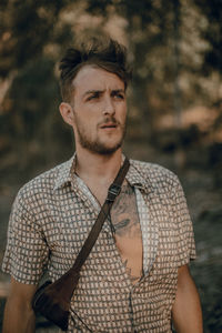 Portrait of young man looking away