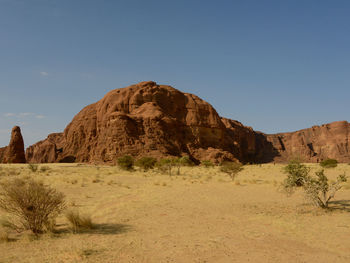 Rock formations in desert against clear sky