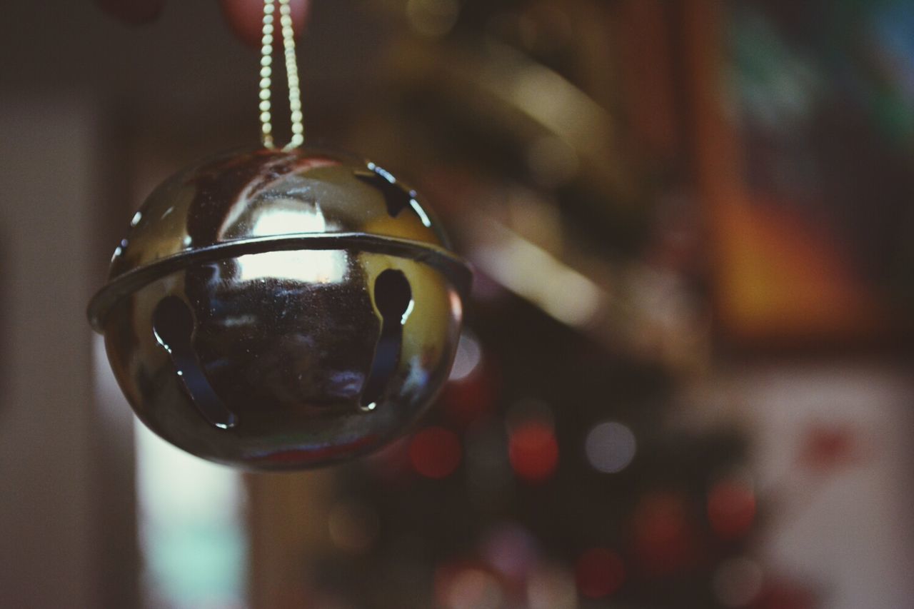 close-up, focus on foreground, transparent, glass - material, indoors, sphere, drinking glass, reflection, still life, illuminated, glass, wineglass, shiny, selective focus, no people, bubble, lighting equipment, drink, refreshment, light bulb