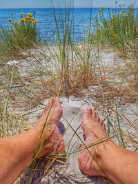 Low section of woman on beach