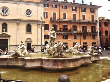 Fountain with buildings in background