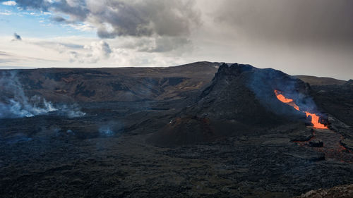 Scenic view of volcanic mountain against sky