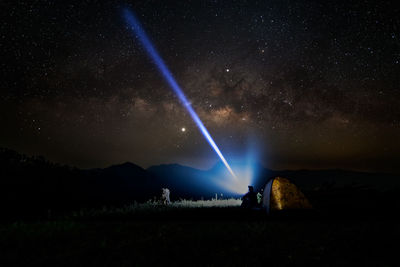 Scenic view of star field against sky at night