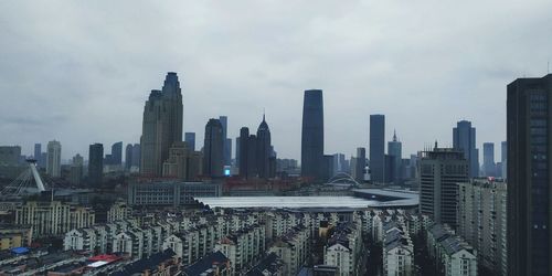 Modern buildings in city against sky