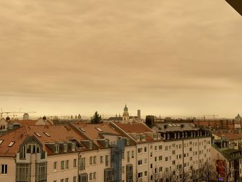 Buildings in city against sky