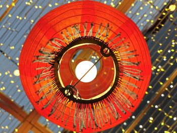 Low angle view of illuminated electric light